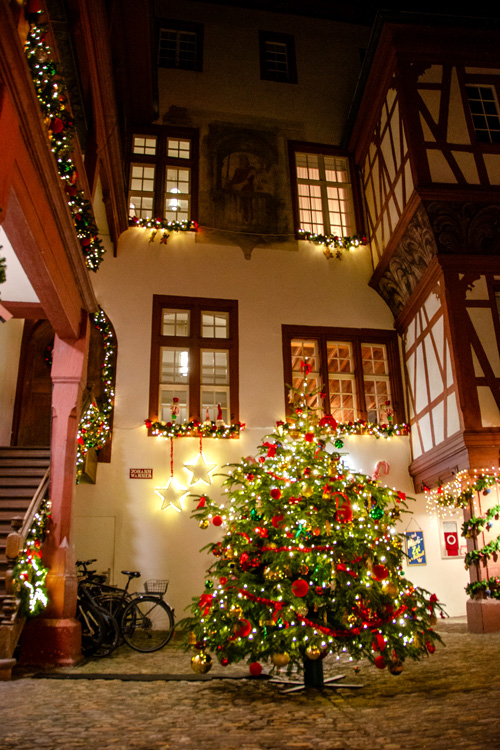 Christmas tree and lights in a cozy courtyard, Basel, Switzerland